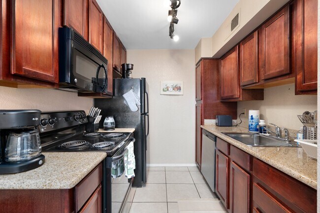 Fully stocked kitchen with a coffee maker, dishwasher and microwave - 3600 N Hayden Rd