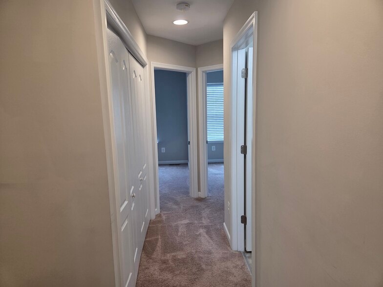 Upstair hallway to other rooms w/ bath on right - 128 Loblolly Dr