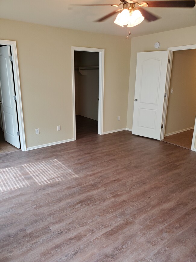 Master bedroom view from corner, into bathroom, closet, and back to hallway - 16021 S 83rd East Ave