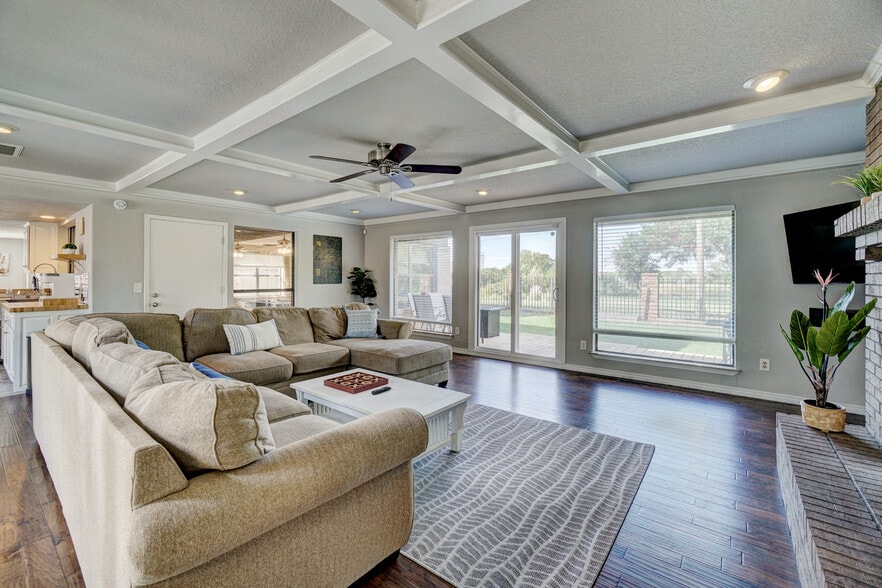 Relax and unwind in the spacious living room (equipped with a 58" Smart TV). - 3905 NW 70th St