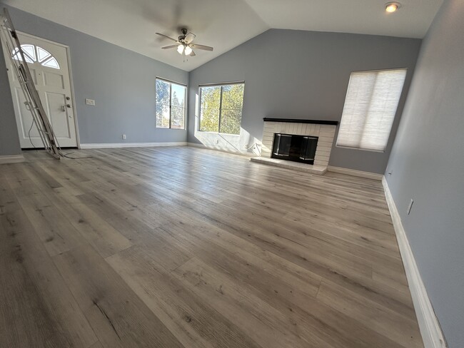 Main room with views and gas fireplace, ceiling fan, track lighting - 3 Vista Barranca