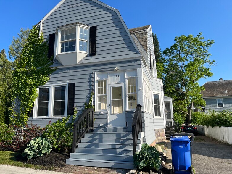 Front door to the downstairs apartment leads you to a beautiful porch before you enter the home. - 401 North St