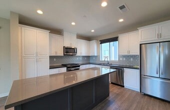 Building Photo - Beautiful and Modern 3-Story Townhome!