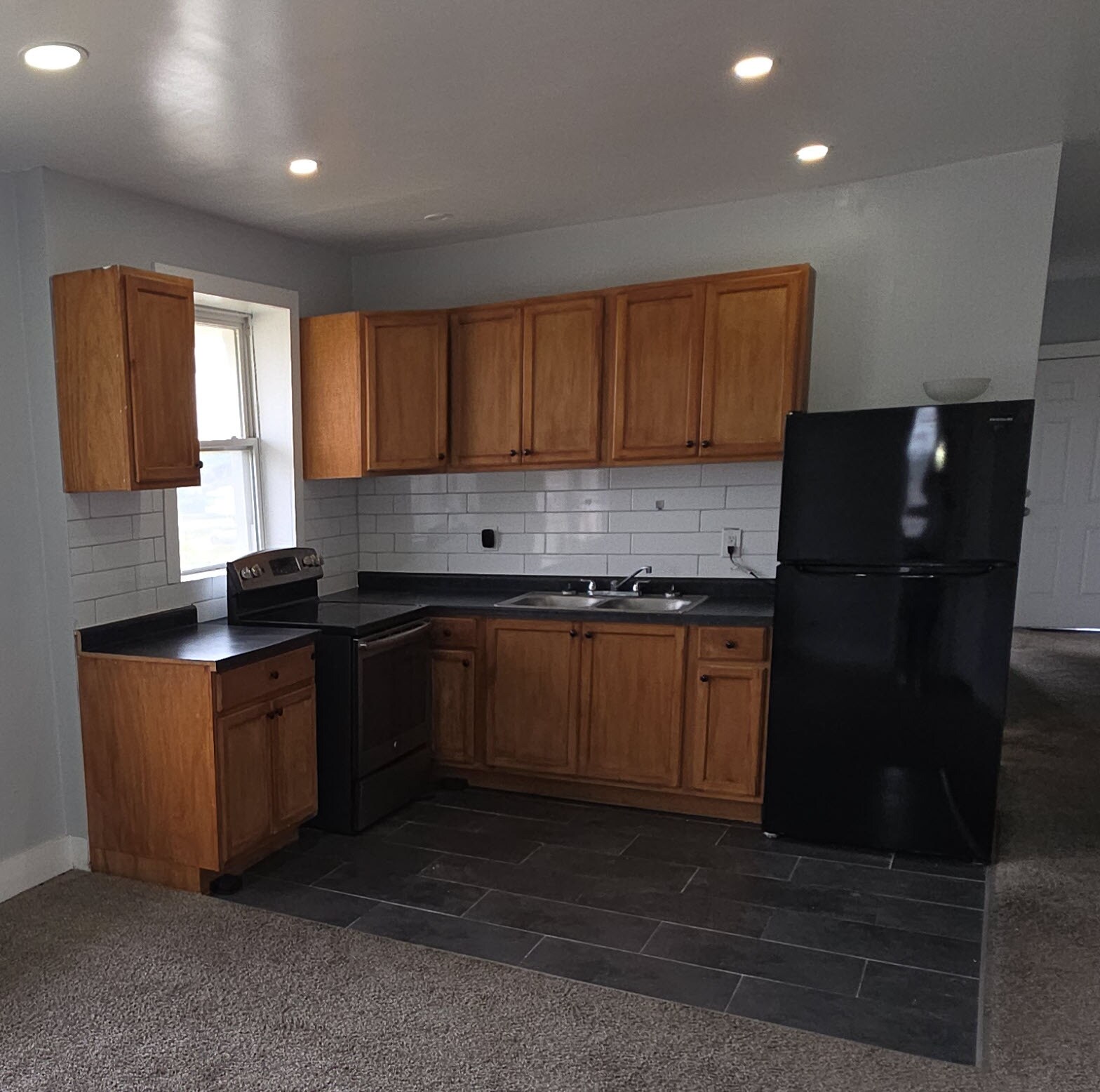 Kitchen with Stove and Fridge - 7061 Elmhurst St