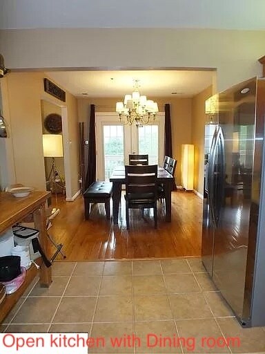 Dining Area with hardwood floor and french door to front deck - 11809 Rockaway Ln