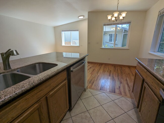 Building Photo - 2x2 duplex with a fenced yard, single-car ...