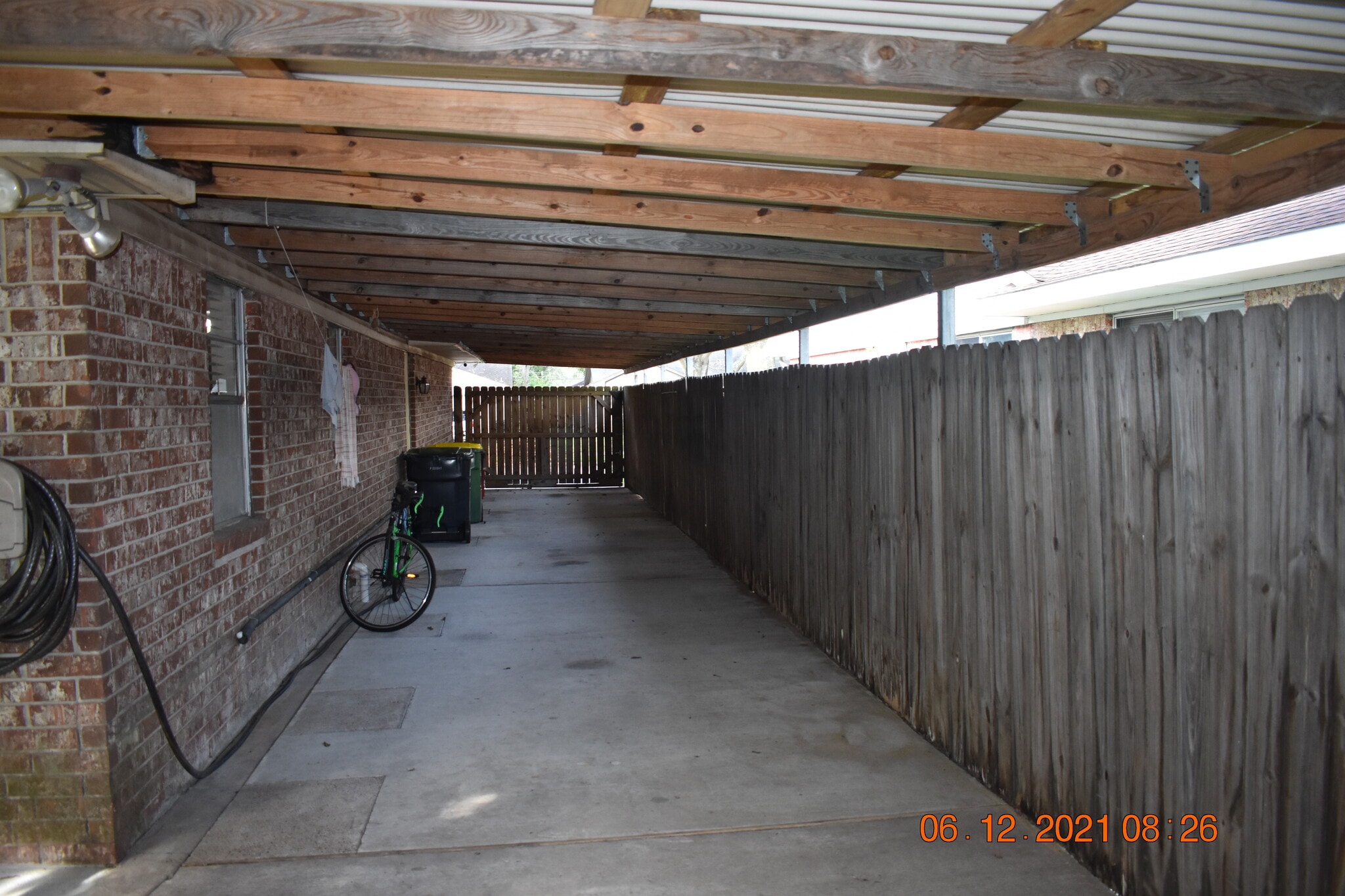 Covered carport area ,fully fenced backyard - 2205 Cedar St