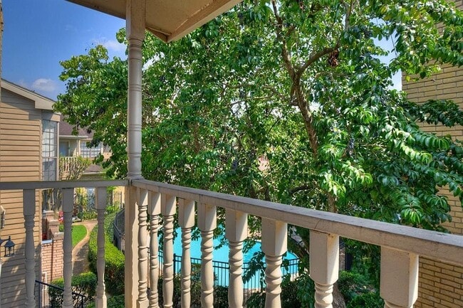 Balcony overlooking garden and community pool - 7350 Kirby Dr