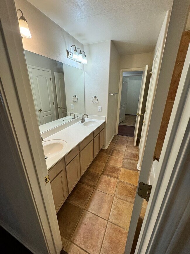 Building Photo - Ready For Move In! A Must See in Rogers Ranch - 4 Bedroom 2 Bath with Custom Features