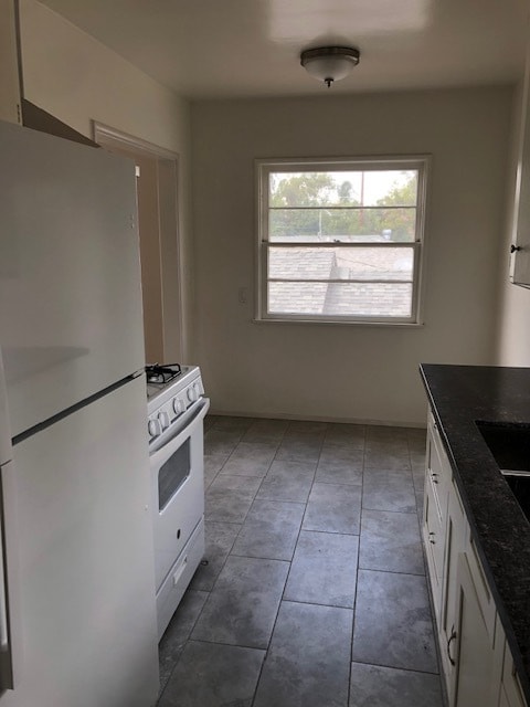 Includes refrigerator and stove - 610 S Main St