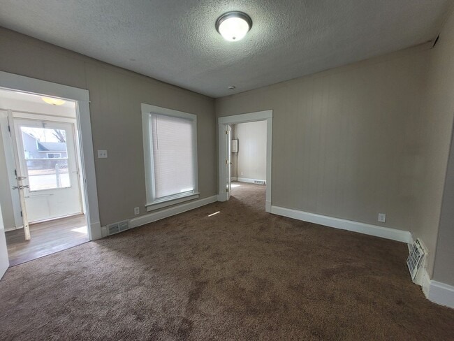 Building Photo - Two bedroom home with partially fenced yard!