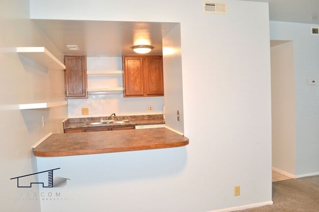 Building Photo - Lower-Level Roy 2 Bedroom, 1 Bathroom Condo Available!