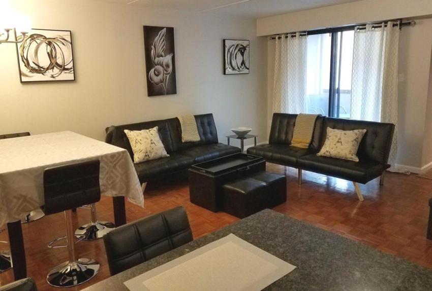 Looking towards the balcony from the living room, dining area and kitchen. - 516 S 12th St
