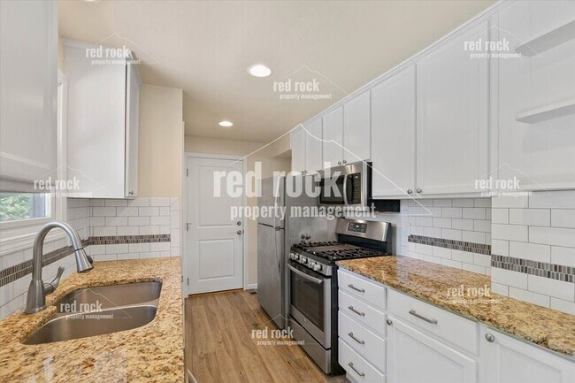 Building Photo - 2211 E 49th Ave