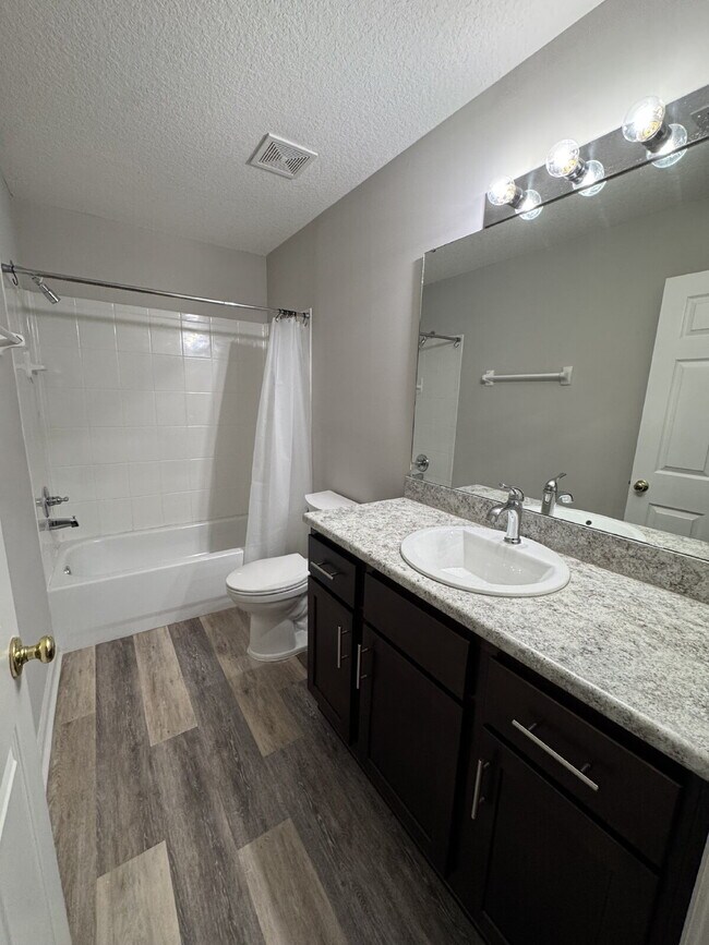 Building Photo - Spacious 4 Bedroom Pond-View Home with Upg...