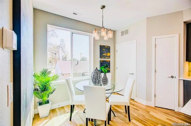 Enjoy meals in this airy dining area, styled with elegance and natural light. - Harley House