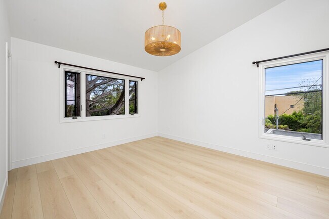 Primary bedroom with views out of both windows - 518 Euclid St