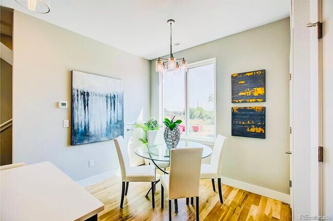 Experience dining in style with this sunlit nook, perfect for intimate meals. - Harley House