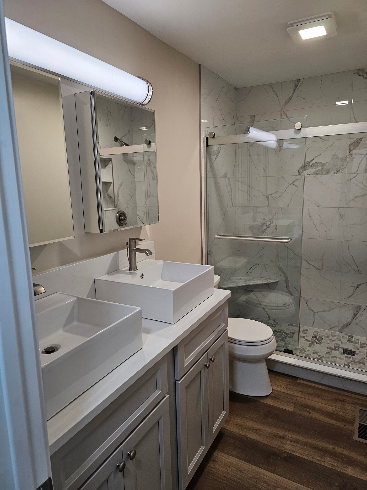 Completely new full bathroom with double vanity, large cabinets and medicine cabinets for storage. - 2788 Blossom Ave