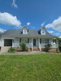 Building Photo - Spacious 4-Bedroom Pet-Friendly Home with Garage and Hardwood Floors