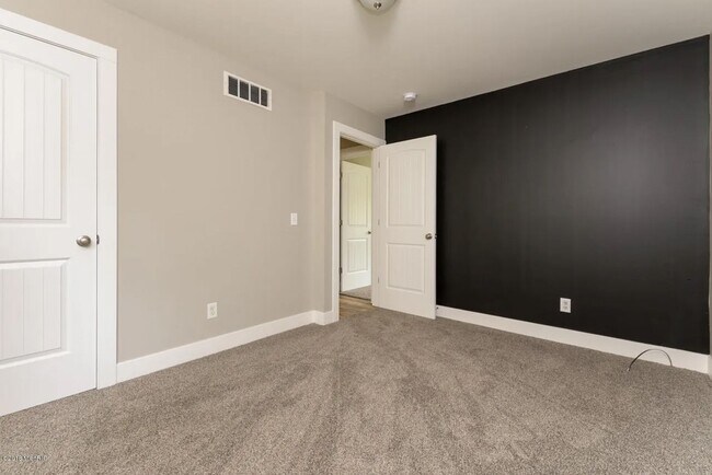 Building Photo - Spacious 3BR Duplex with Finished Basement & 2-Car Garage in Otsego