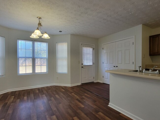 Building Photo - Experience modern living in this stunning two-story townhome! Awesome School District