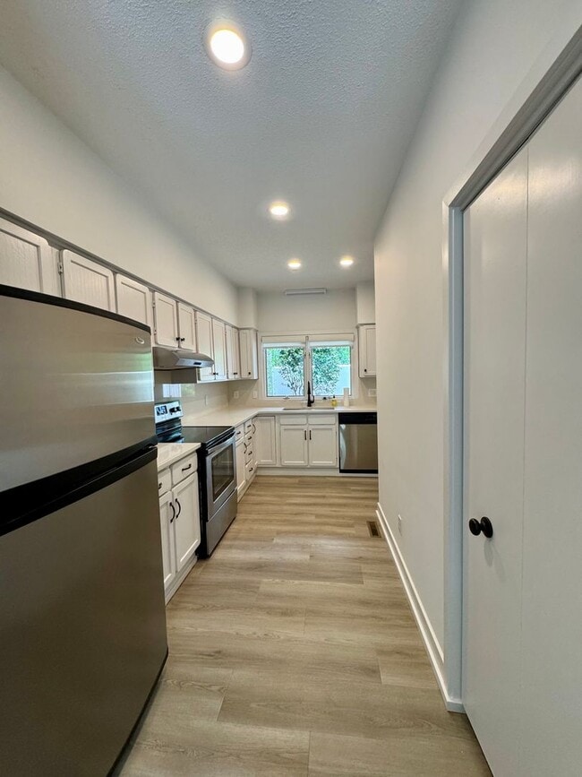 Building Photo - Spacious 2-Story Falconbridge Condo with Private Courtyard and Resort-Style Amenities