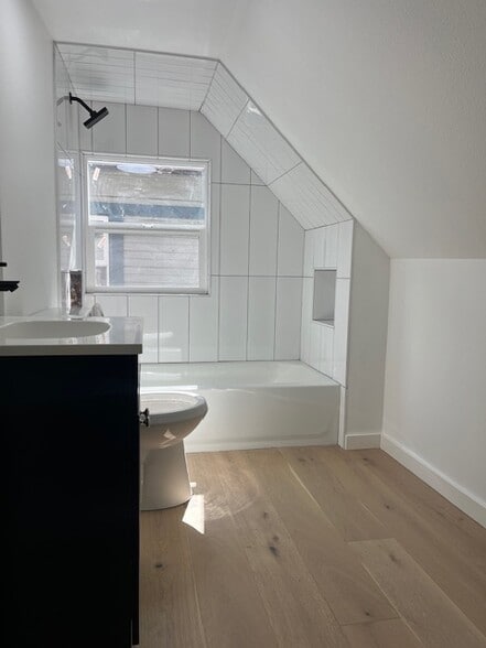New bathroom with tub/shower and tile surround - 638 NE Prescott St