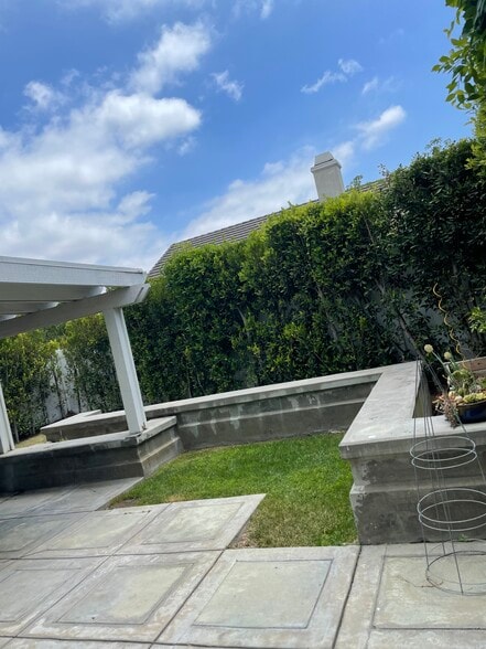 The backyard is private and full of lush greenery. - 3736 Armitage Ave