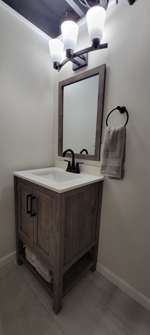 Basement Bath includes Shower, new tile, new toilet, new light fixtures, new vanity, new faucet, - 6305 49th Ave
