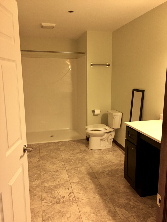 Spacious bathrooms, some handicapped accessible showers - 143 S Main St