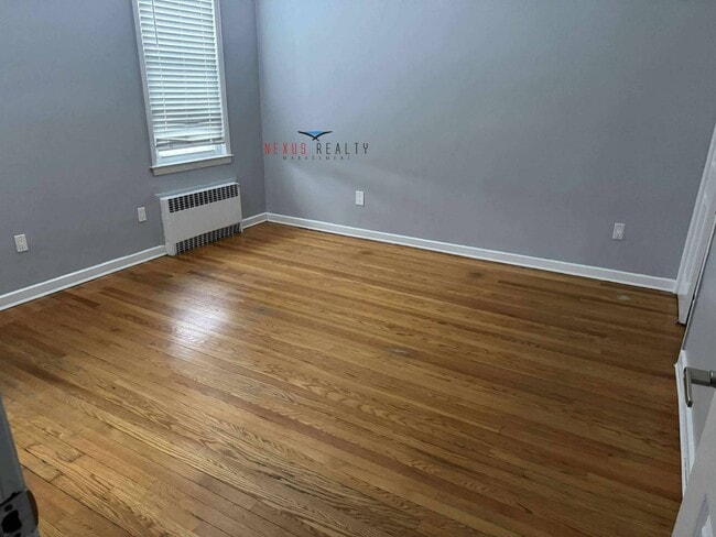 Building Photo - 21-44-44 71st St