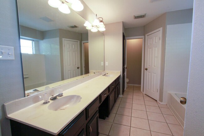 Building Photo - Updated 4 Bedroom • 2.5 Bath • West Round Rock • Downstairs Primary Suite • Two Living Areas • La...