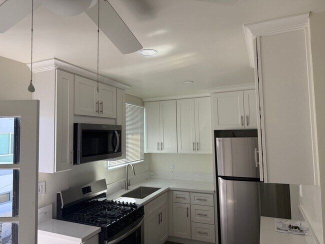 Building Photo - FOR RENT — COMPLETELY REMODELED Apartment