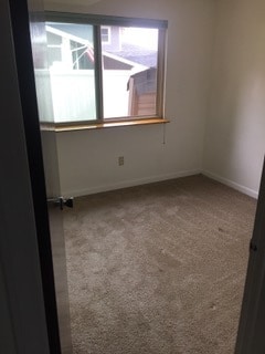 Bed room with window facing south - Gilcrest Apartments - Utilities Included