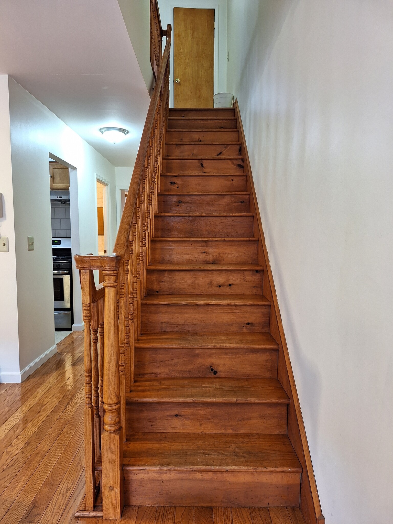 Stairs to 3rd floor (lights on) - 1229 Wood St