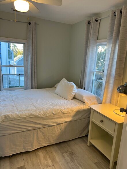 One bedroom has a big bed, 2 windows. - 749 1st St