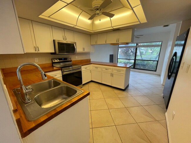 Building Photo - ANNUAL RENTAL - 2 + DEN / 2 BATH VILLA AT ...