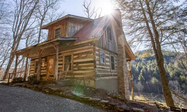 Building Photo - One of a Kind – Authentic Log Cabin with S...