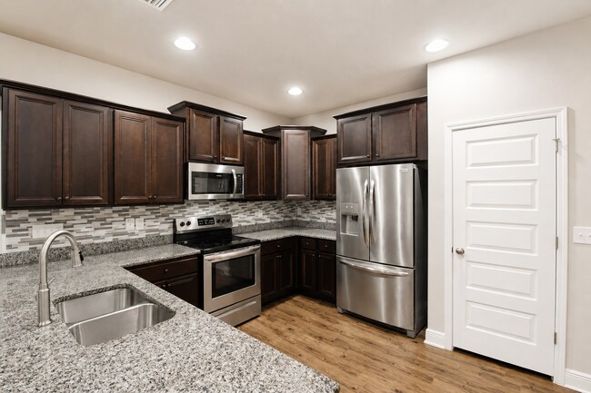 Building Photo - Spacious Pace Home Featuring 4 Bedrooms, 3.5 Baths, Two Living Areas & First-Floor Primary Suite ...
