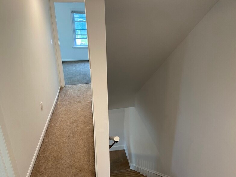 Stairs leading through upstairs hallway - 114 Morgan Ave
