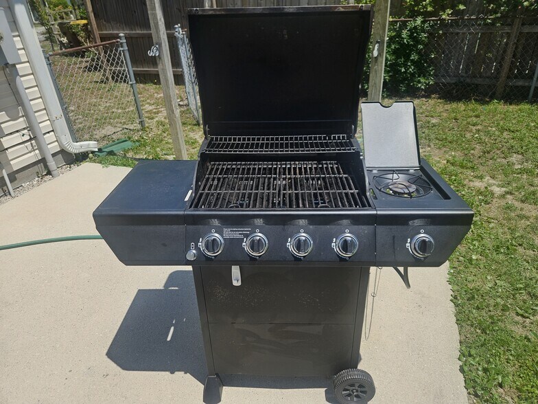 A 4-burner grill on the back porch for BBQs! - 2127 Winter Moss Ln