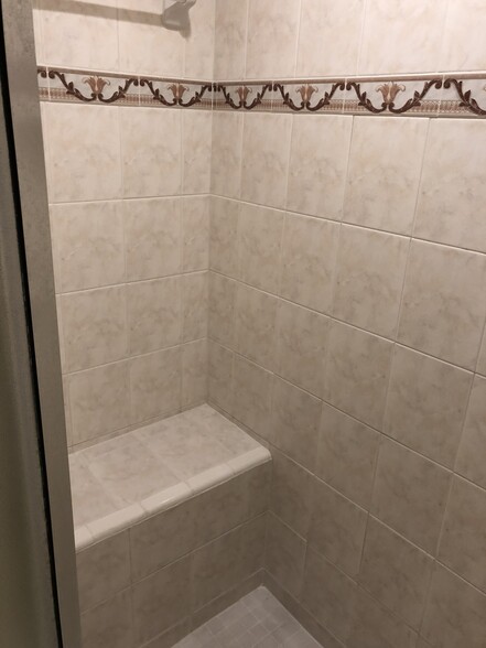 walk in shower with seat fully tiled - 10212 N 12th St