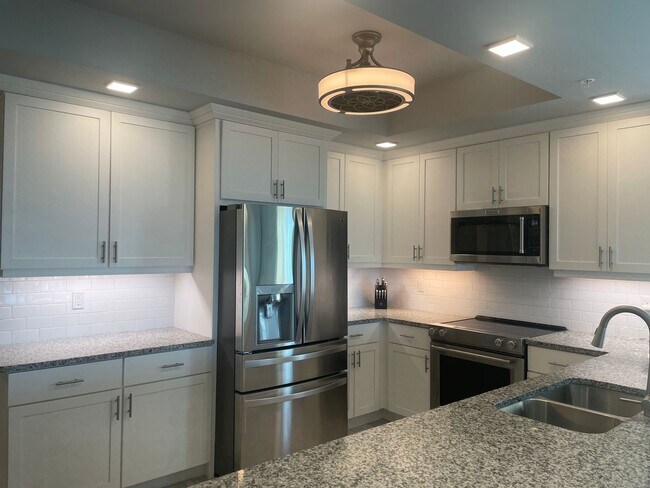Building Photo - Coastal Luxury at Hidden Bay | 3BR Waterfront Condo with Bay Views
