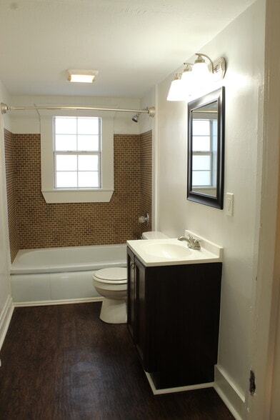 The large bathroom has a lovely tub/shower and lots of light. - 1309-C Jones Avenue