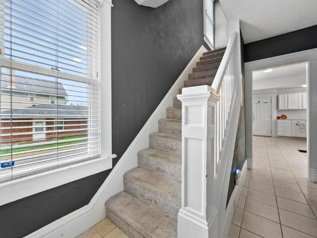 stairs to upstairs - 301 E Moler St