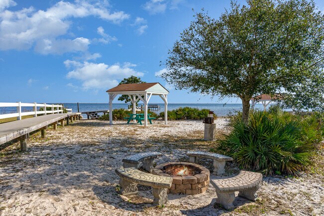 There is a community sound access with a sandy beach section. - 6464 Starfish Cv