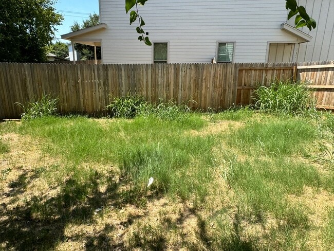 Building Photo - Move Fast! Gated Townhome Near Lackland AFB with Private Yard & EV-Ready Garage