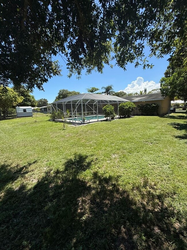 Building Photo - 3/2/1 POOL Home with Fenced Yard--Pool & Y...
