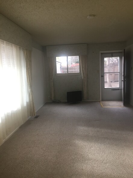 Front entrance from living roomKitchenLiving room with picture window to pikes peak - 638 Gilcrest Rd